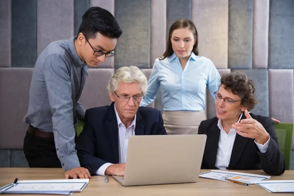 Business professionals reviewing international factoring invoices and export documents