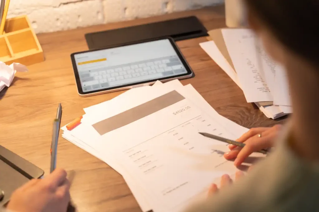 Business receiving cash advance against unpaid invoices for improved cash flow