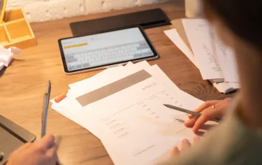 Business receiving cash advance against unpaid invoices for improved cash flow